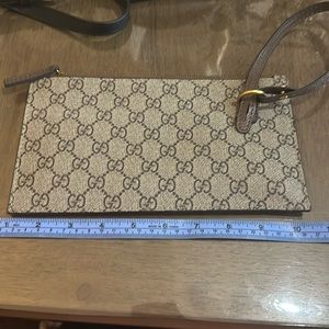 Brown and tan like clutch with gold metal